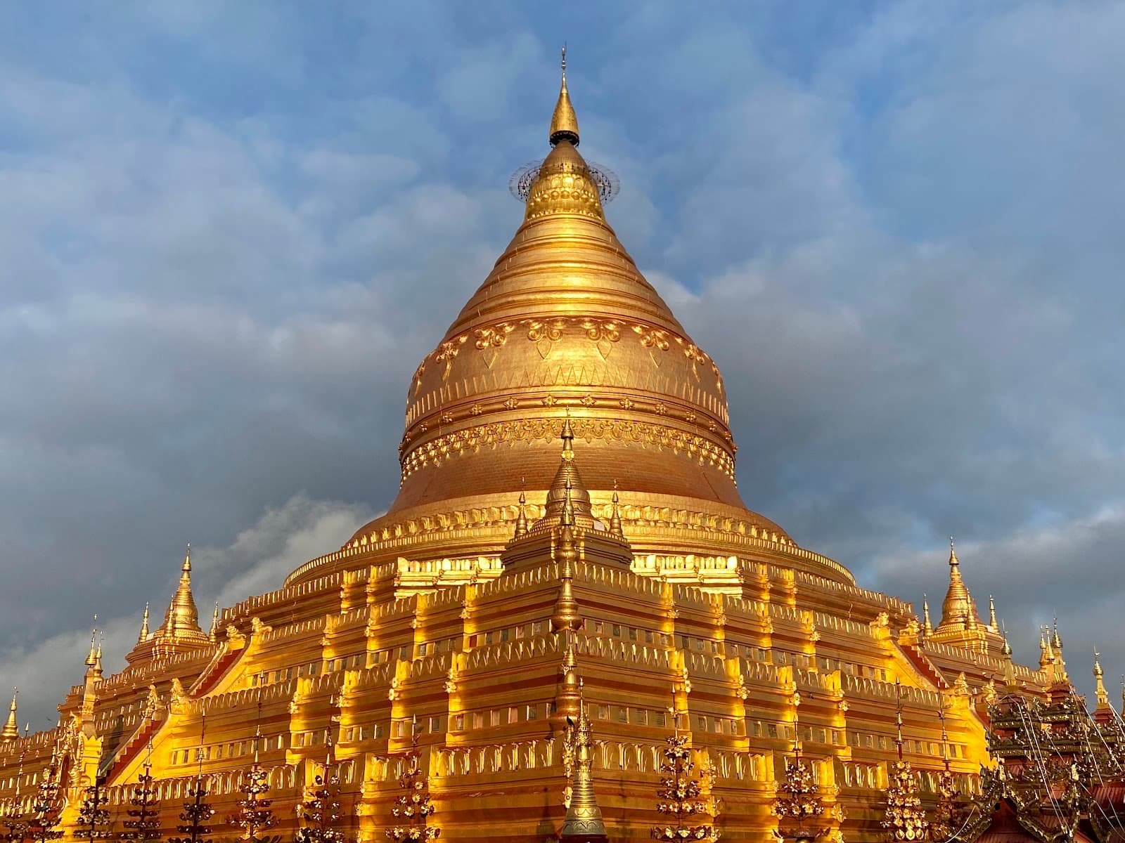 Shwezigon Pagoda, located in Nyaung-U within the Bagan Archaeological Zone, represents one of the most significant Buddhist pagodas in Myanmar, constructed in the 11th century CE during the reign of K...